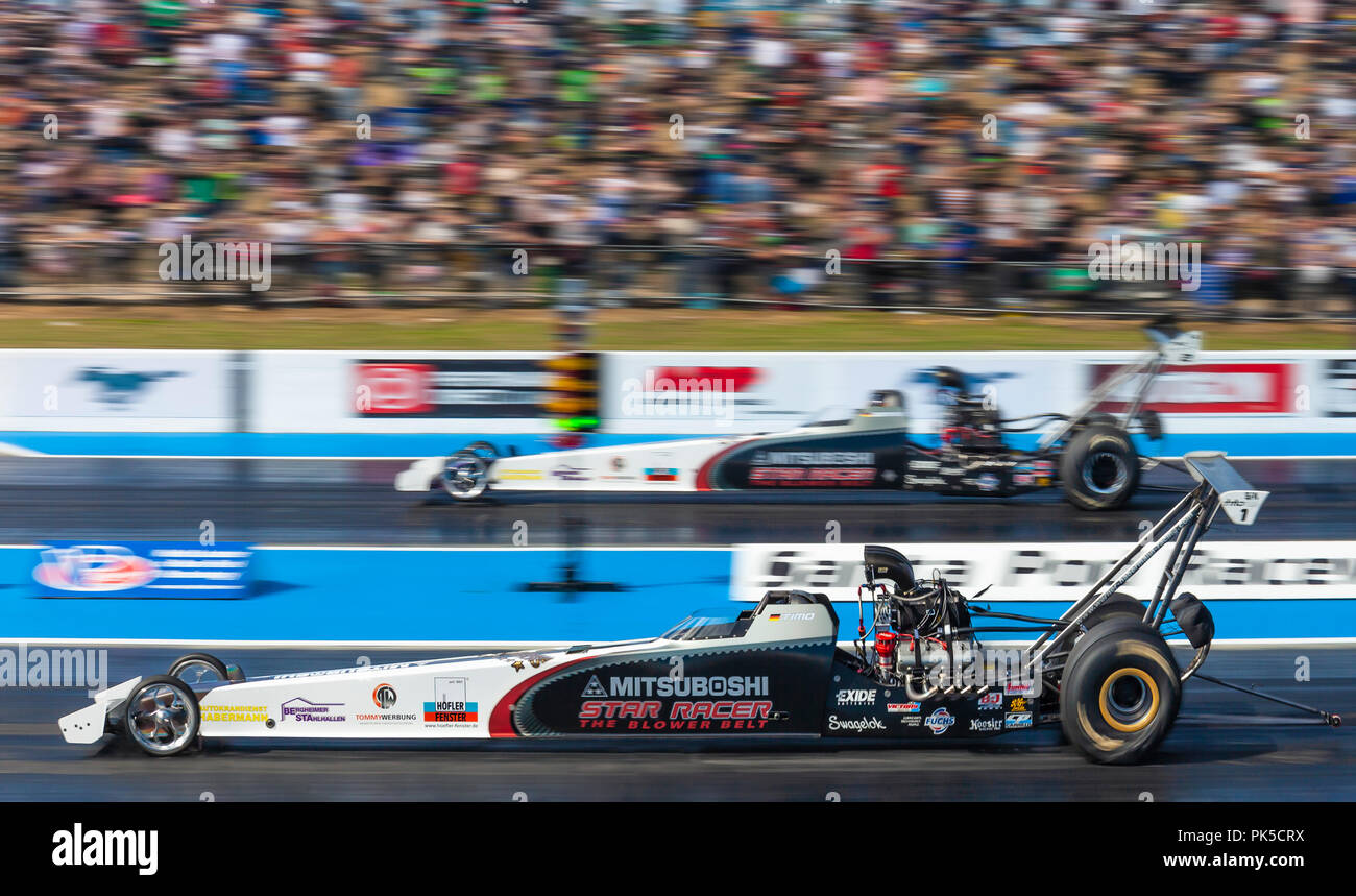 Top Methanol drag racing at Santa Pod Raceway. Timo Habermann nearside v Dennis Habermann far side. Stock Photo