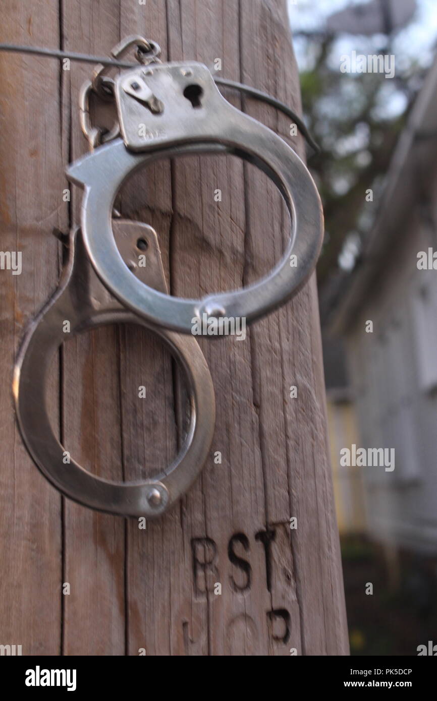 Handcuffs on a light pole Stock Photo Alamy
