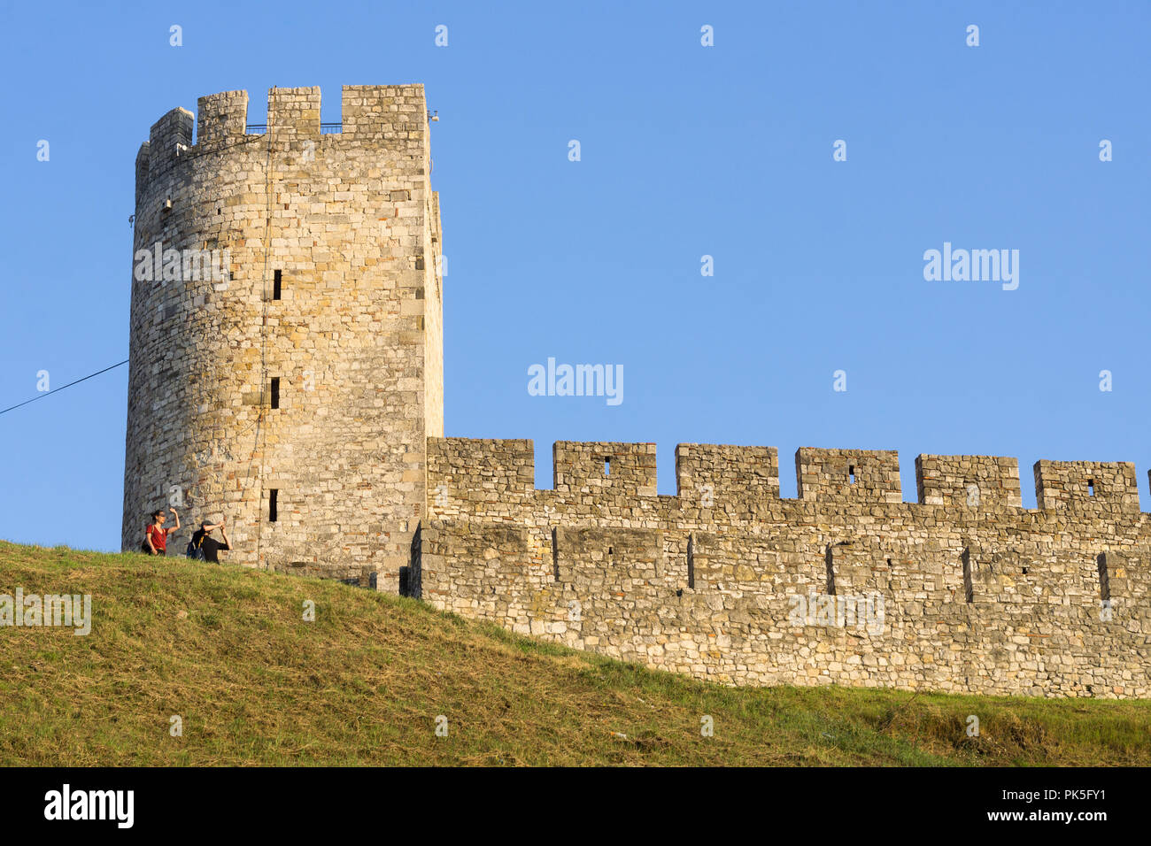 Tourists checking the view near the Dizdar tower at the Belgrade fortress Kalemegdan, Serbia. Stock Photo
