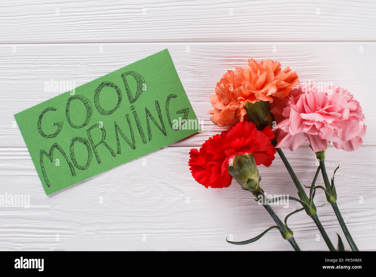Good Morning Wish Note And Colorful Carnation Flowers White Wood