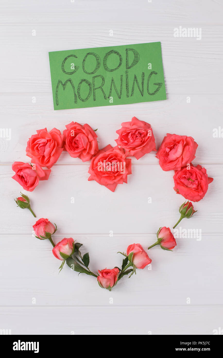 Heart composition made of red rose flowers. Good morning wish ...