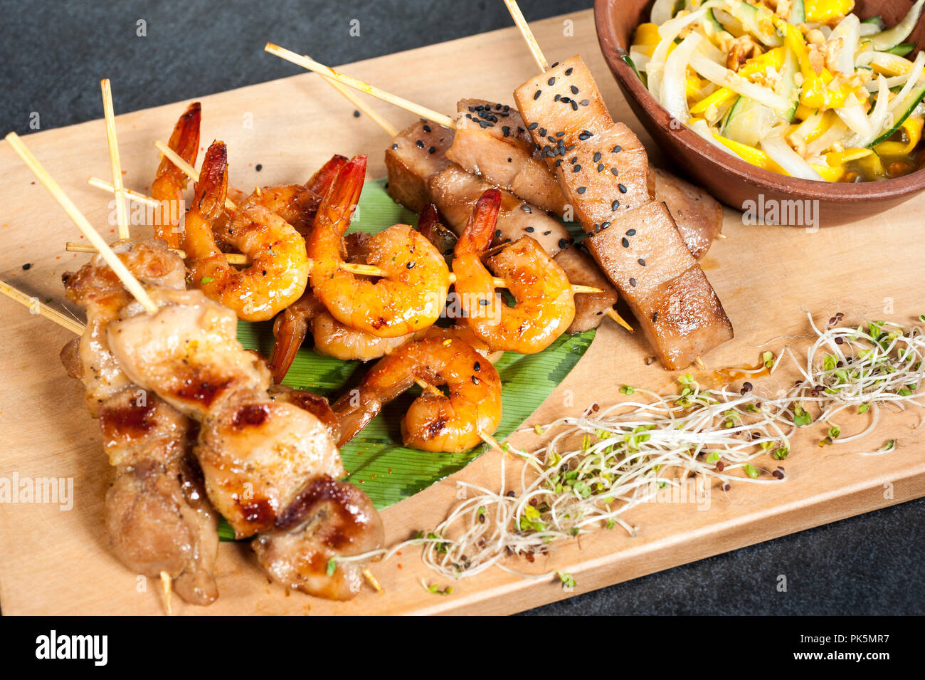Mixed skewers, chicken, fish and cow meat. Stock Photo