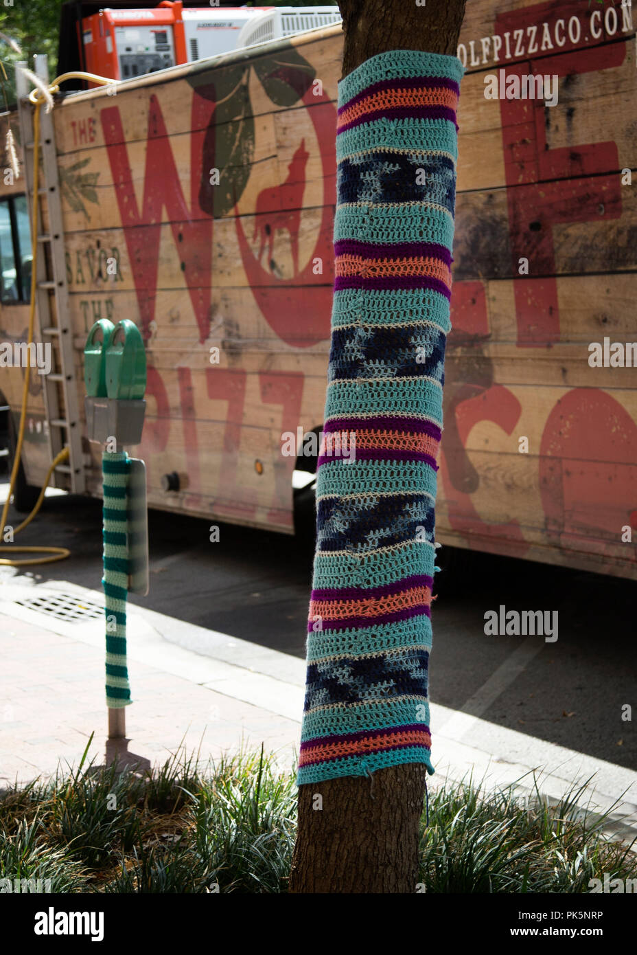 group of guerrilla knitters attacked Main Street Columbia south carolina,they yarn bombed Trees, signs, parking meters, lampposts and bike racks along the 1500 block main Street photo by Catherine Brown Stock Photo