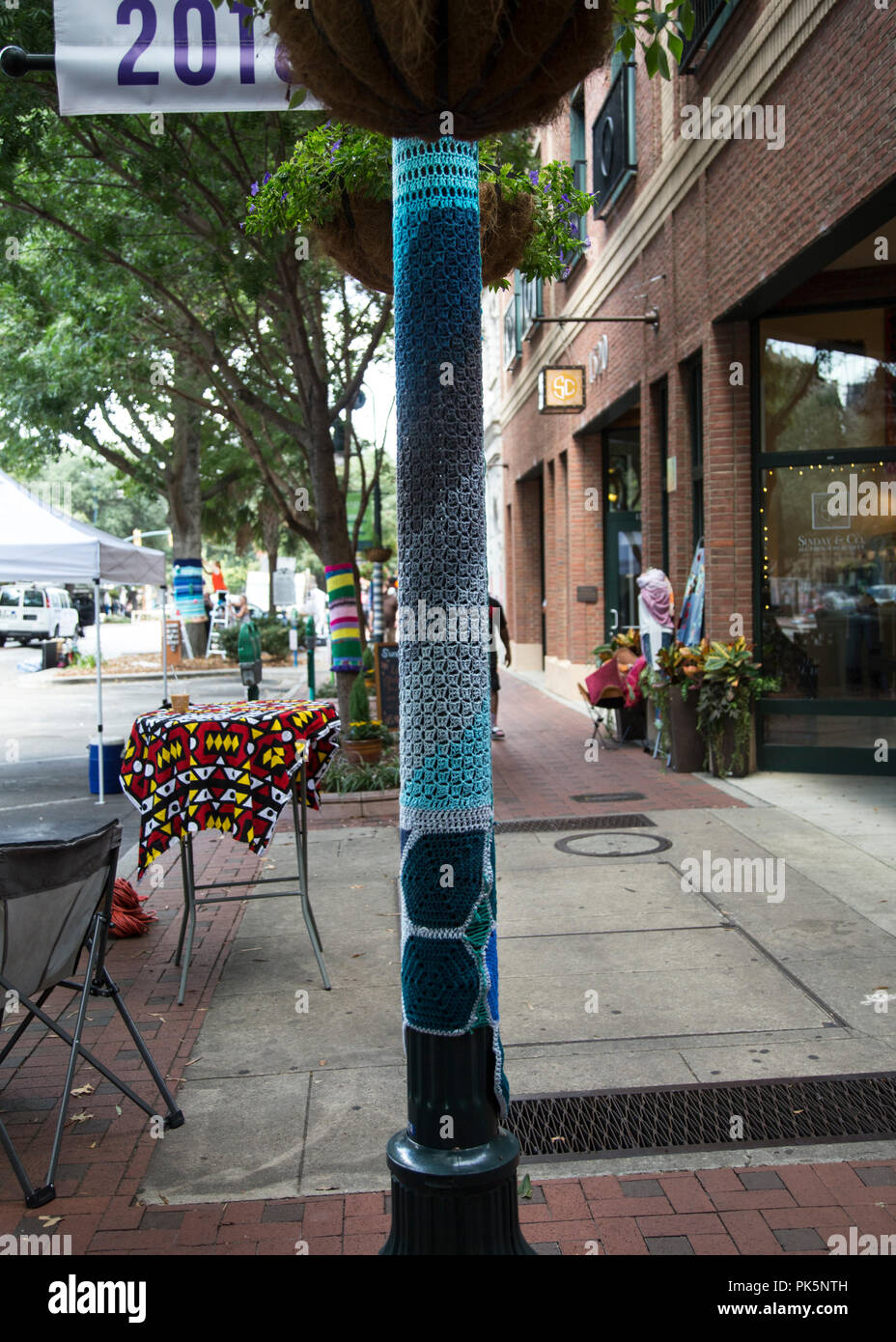 group of guerrilla knitters attacked Main Street Columbia south carolina,they yarn bombed Trees, signs, parking meters, lampposts and bike racks along the 1500 block main Street photo by Catherine Brown Stock Photo