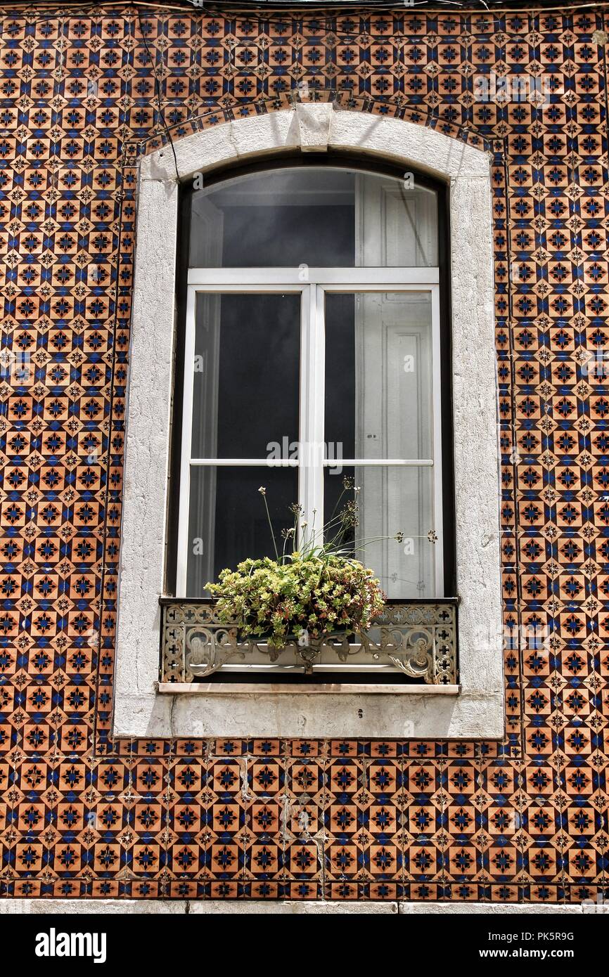 Old colorful and majestic tiled facades with vintage streetlight in ...