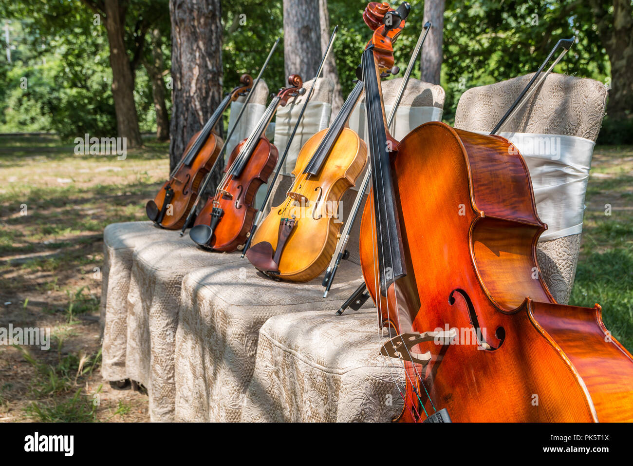 String quartet instruments on chairs hi-res stock photography and ...