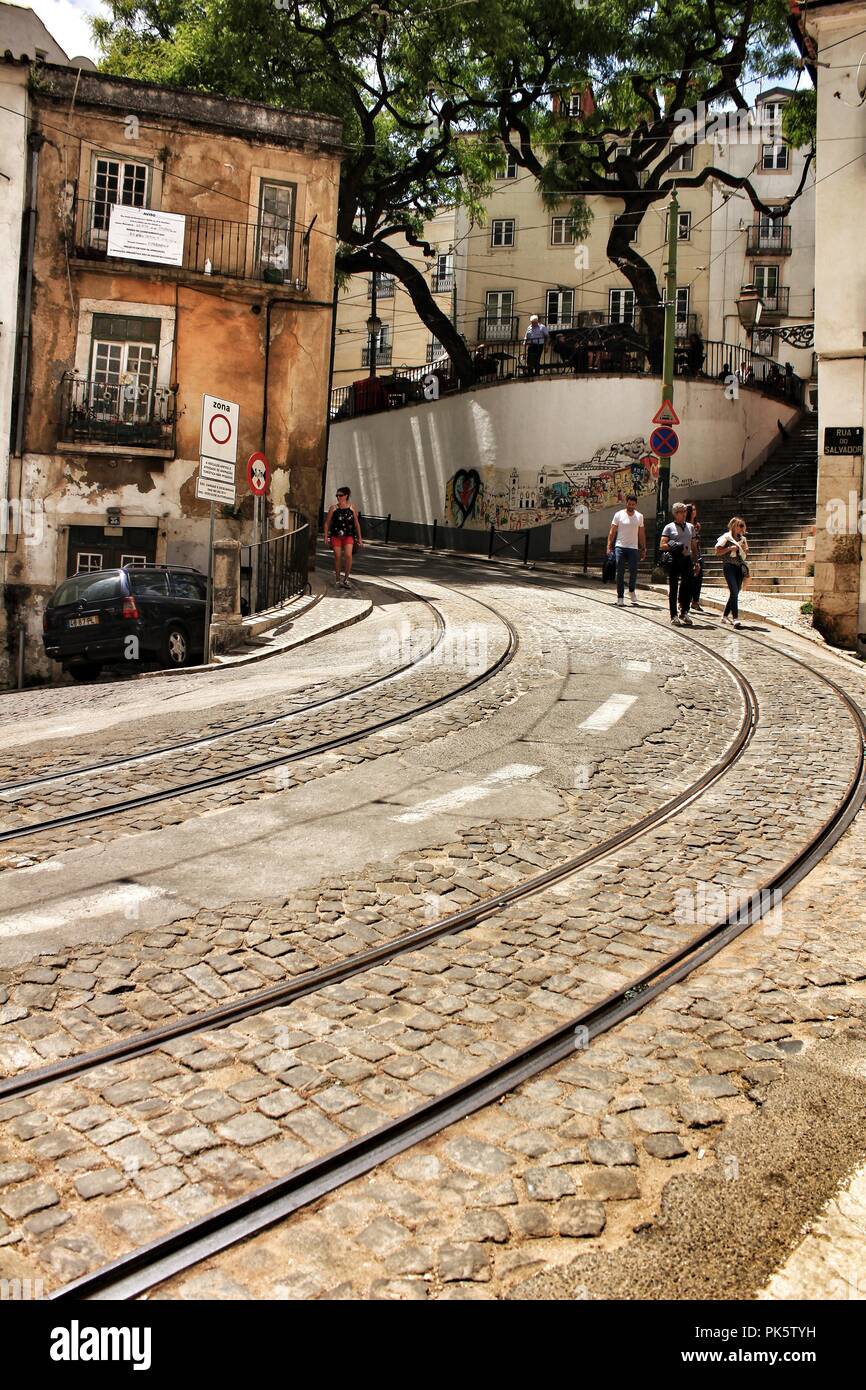 Lisbon, Portugal- June 10, 2018: Old colorful houses and narrow streets of Lisbon, Portugal in Spring. Majestic facades and old street lights. Stock Photo