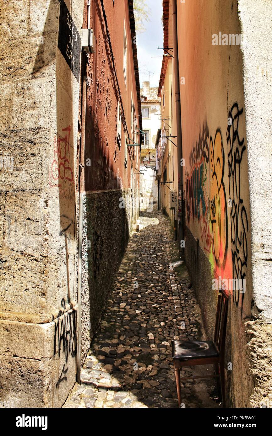 Lisbon, Portugal- June 10, 2018: Old colorful houses and narrow streets of Lisbon, Portugal in Spring. Majestic facades and old street lights. Stock Photo