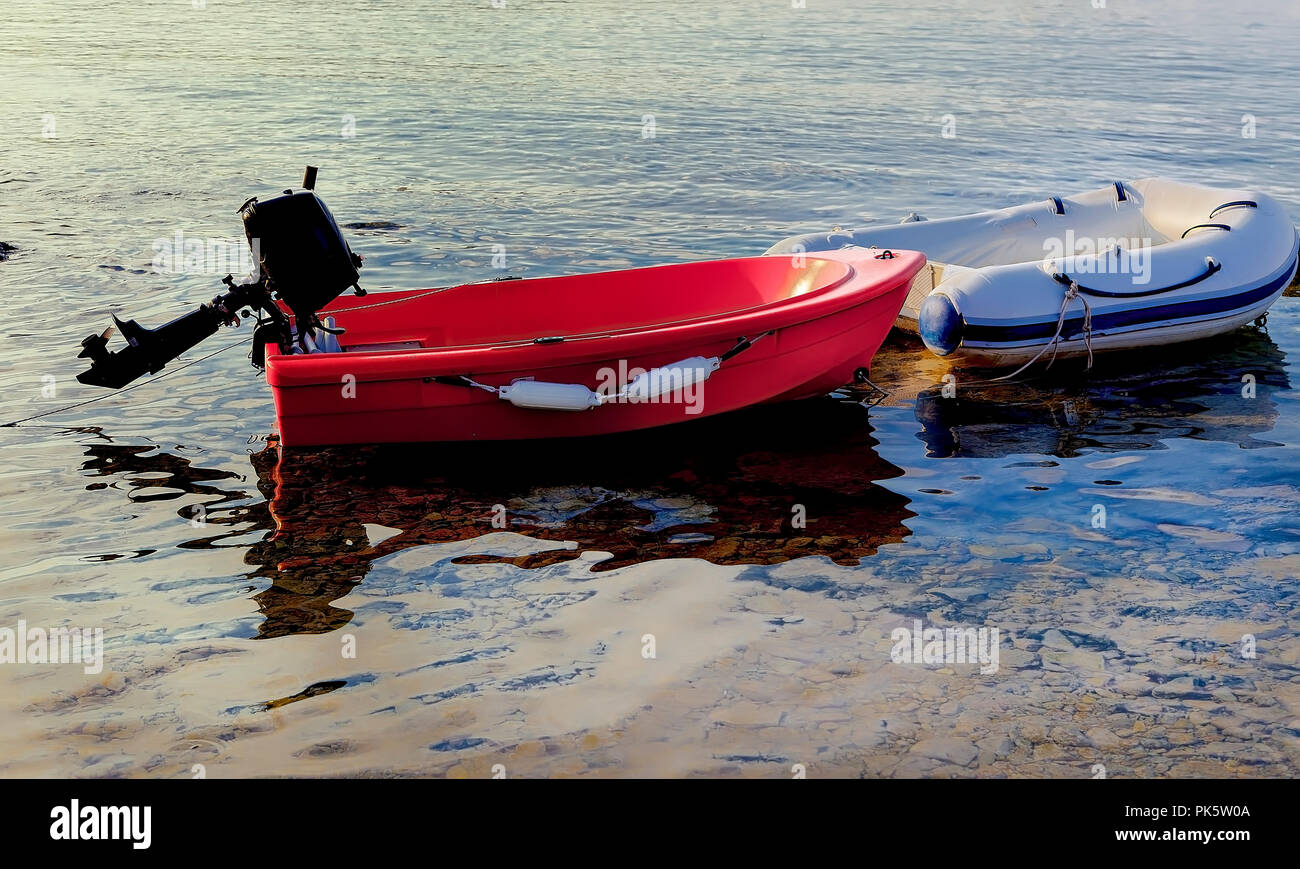 Inflatable dinghy outboard motor hires stock photography and images