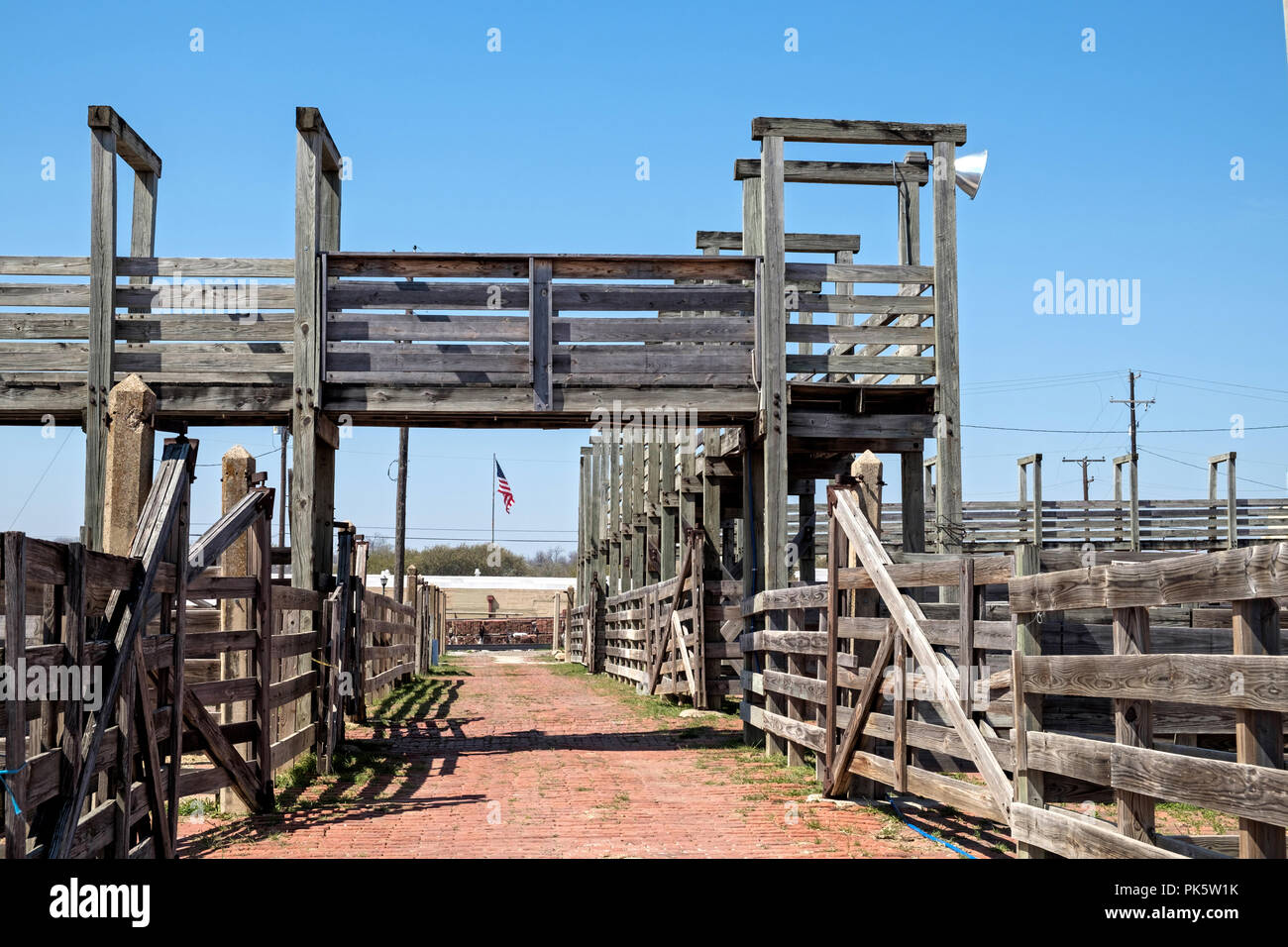 Empty  wooden cattle pens in Fort Worth Stockyards, Texas.  American Flag. Horizontal. Stock Photo