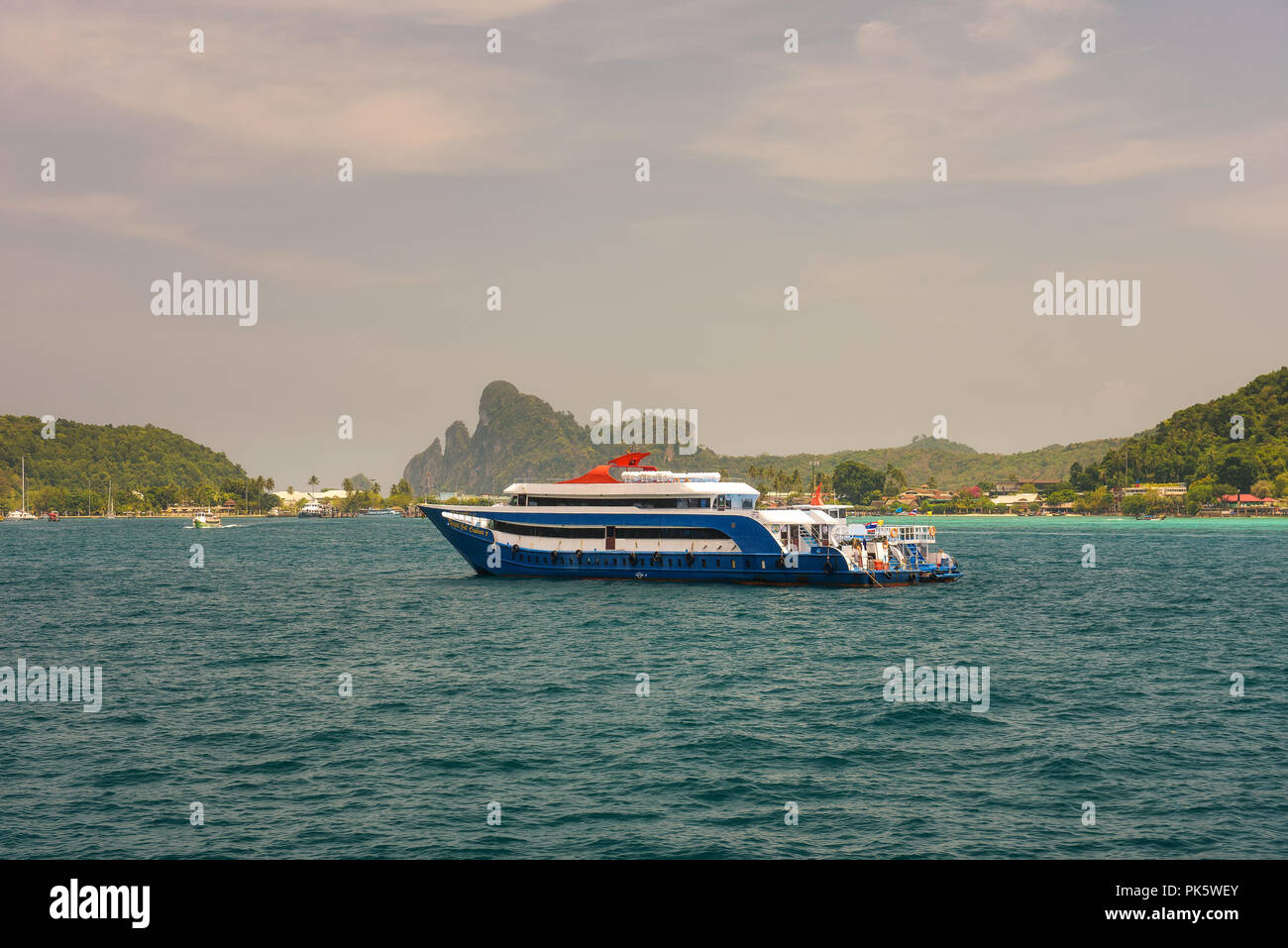 Luxury yacht floating to the harbour of Phi Phi island in Thailand Stock Photo