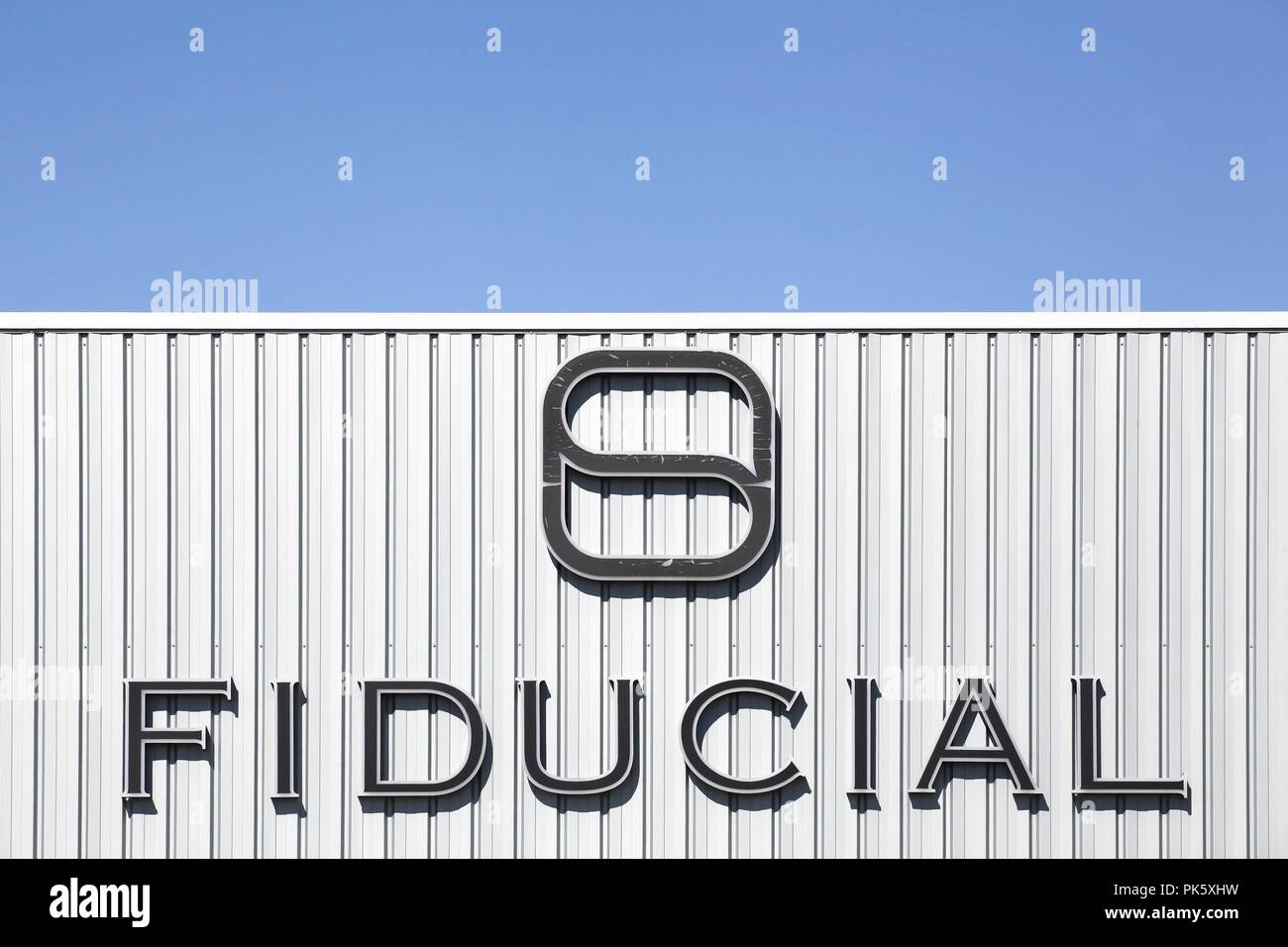 Saint Priest, France - September 8, 2018: Fiducial logo on a wall. Fiducial is a French company and the leading provider of multidisciplinary services Stock Photo