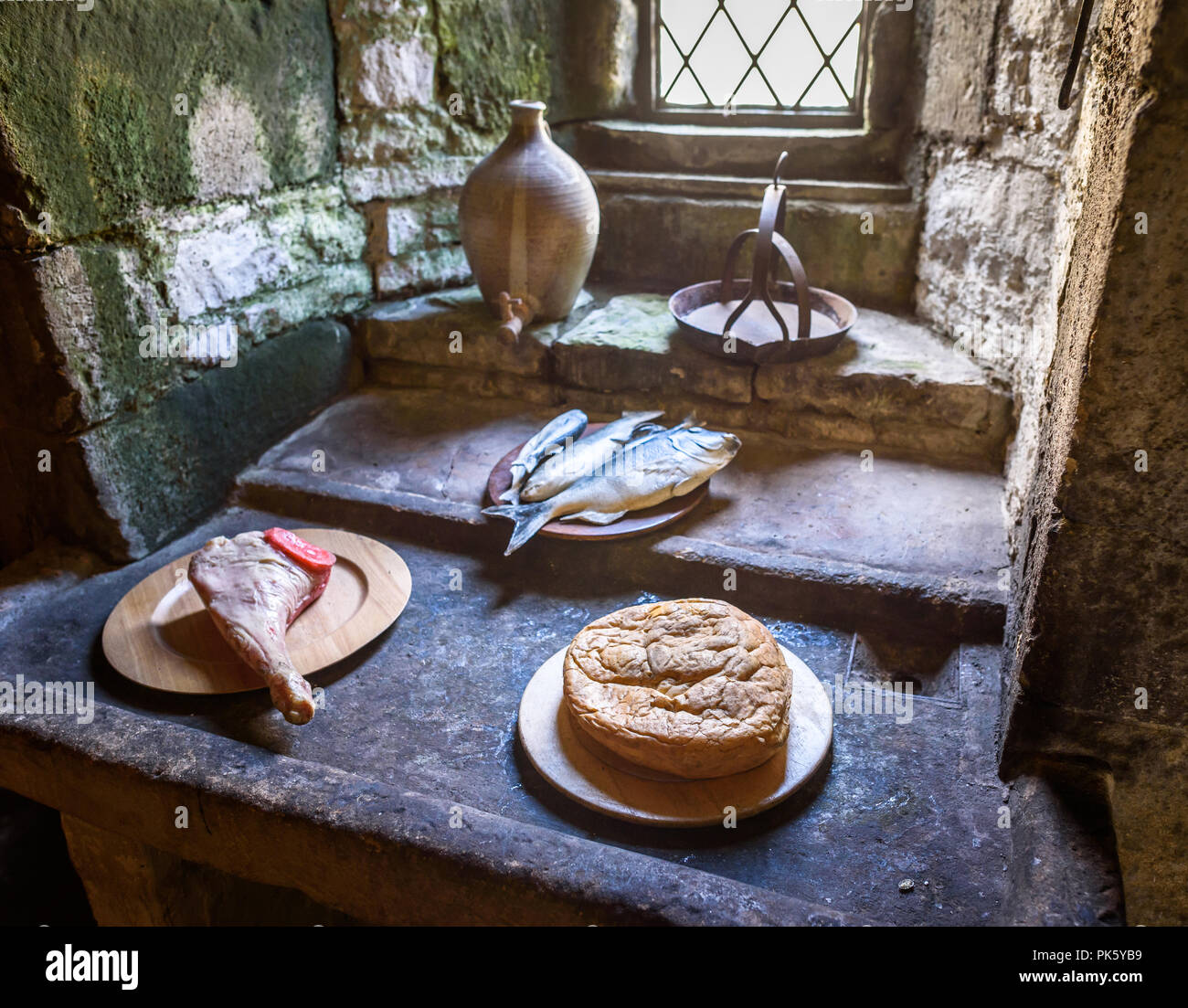 A still life of food eaten in medieval times inside the kitchen stone monastery. Stock Photo