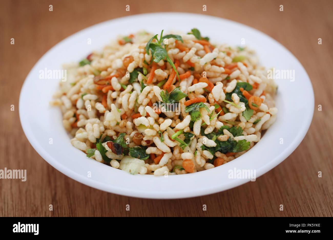 Puffed with hot spices and Bombay mix in a bowl Stock Photo