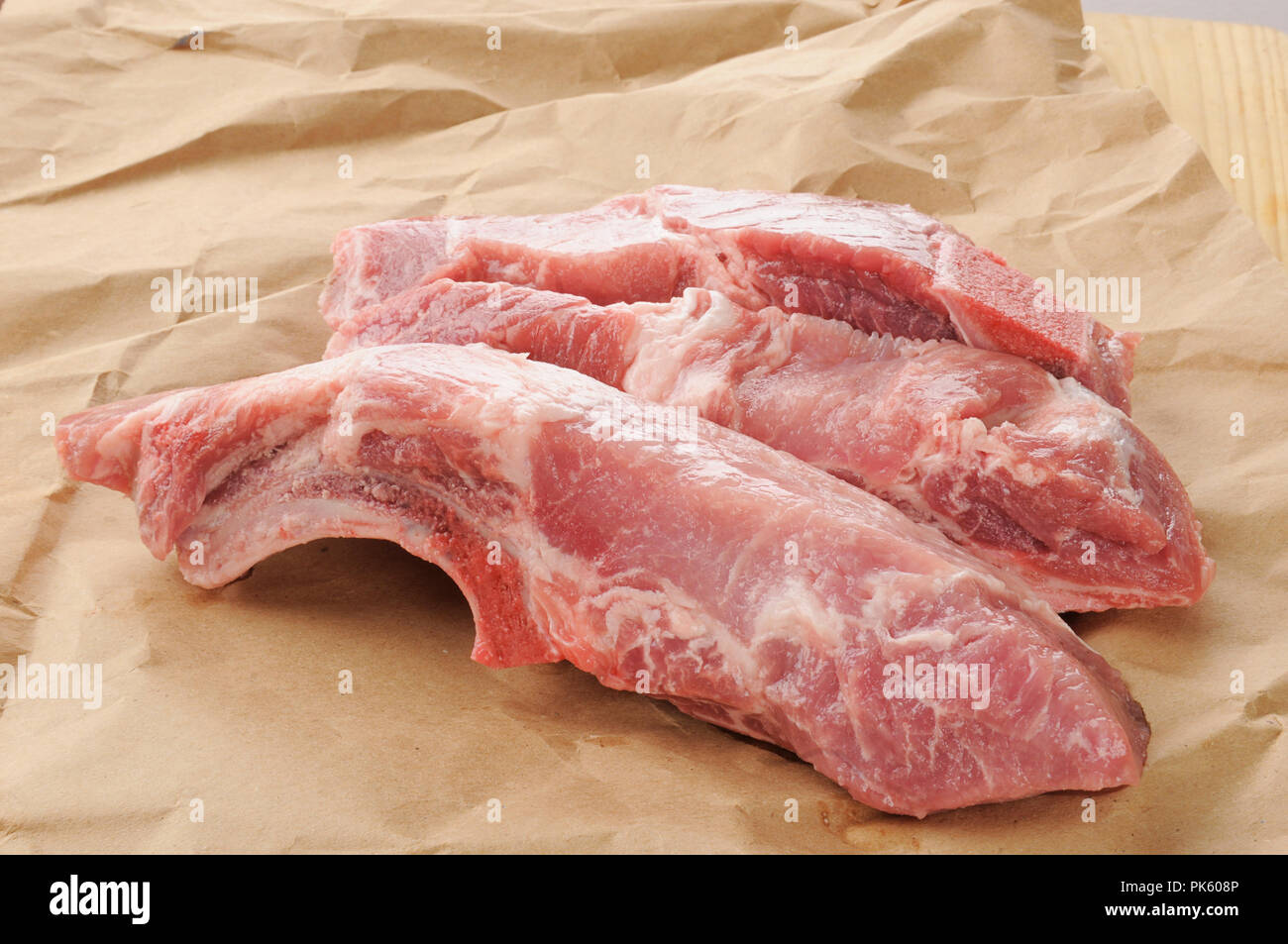 Raw pork ribs on butcher paper Stock Photo Alamy