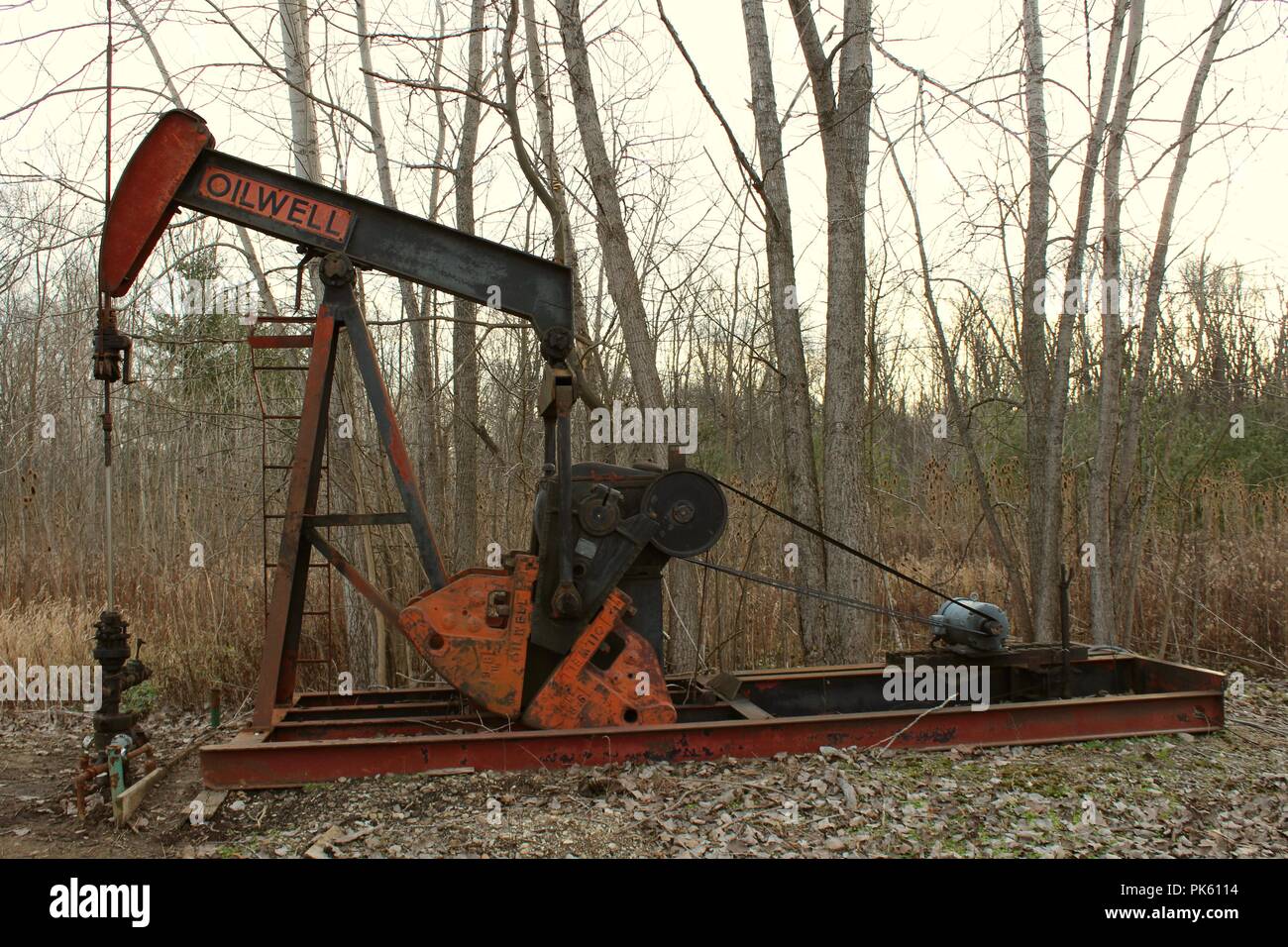 old oil well in a rural setting Stock Photo