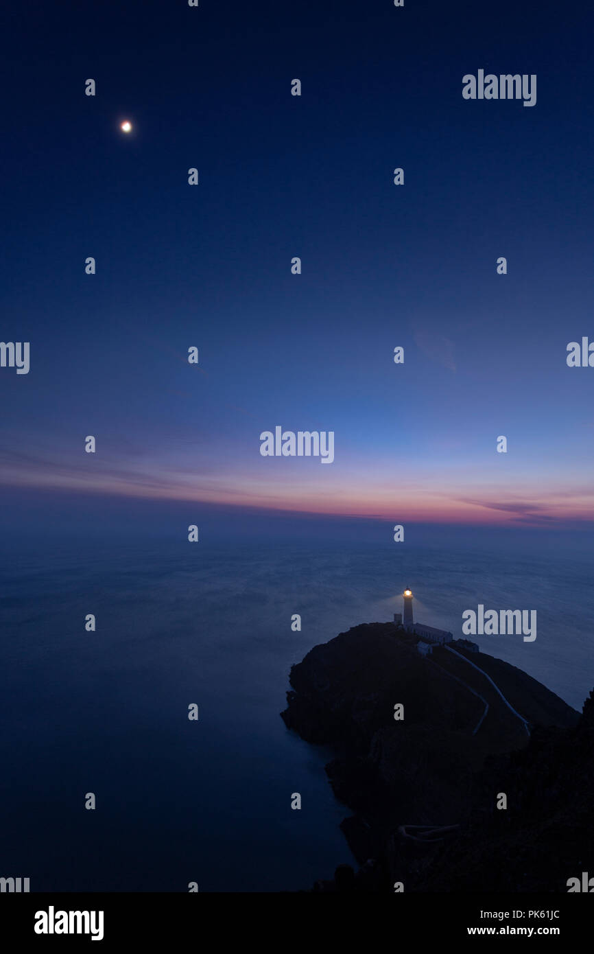 South Stack lighthouse at twilight on the coast of Anglesey, North Wales Stock Photo