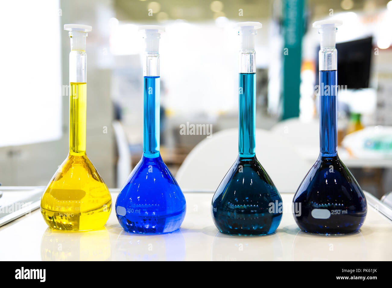 Laboratory equipment, lots of glass filled with colorful liquids. Stock Photo