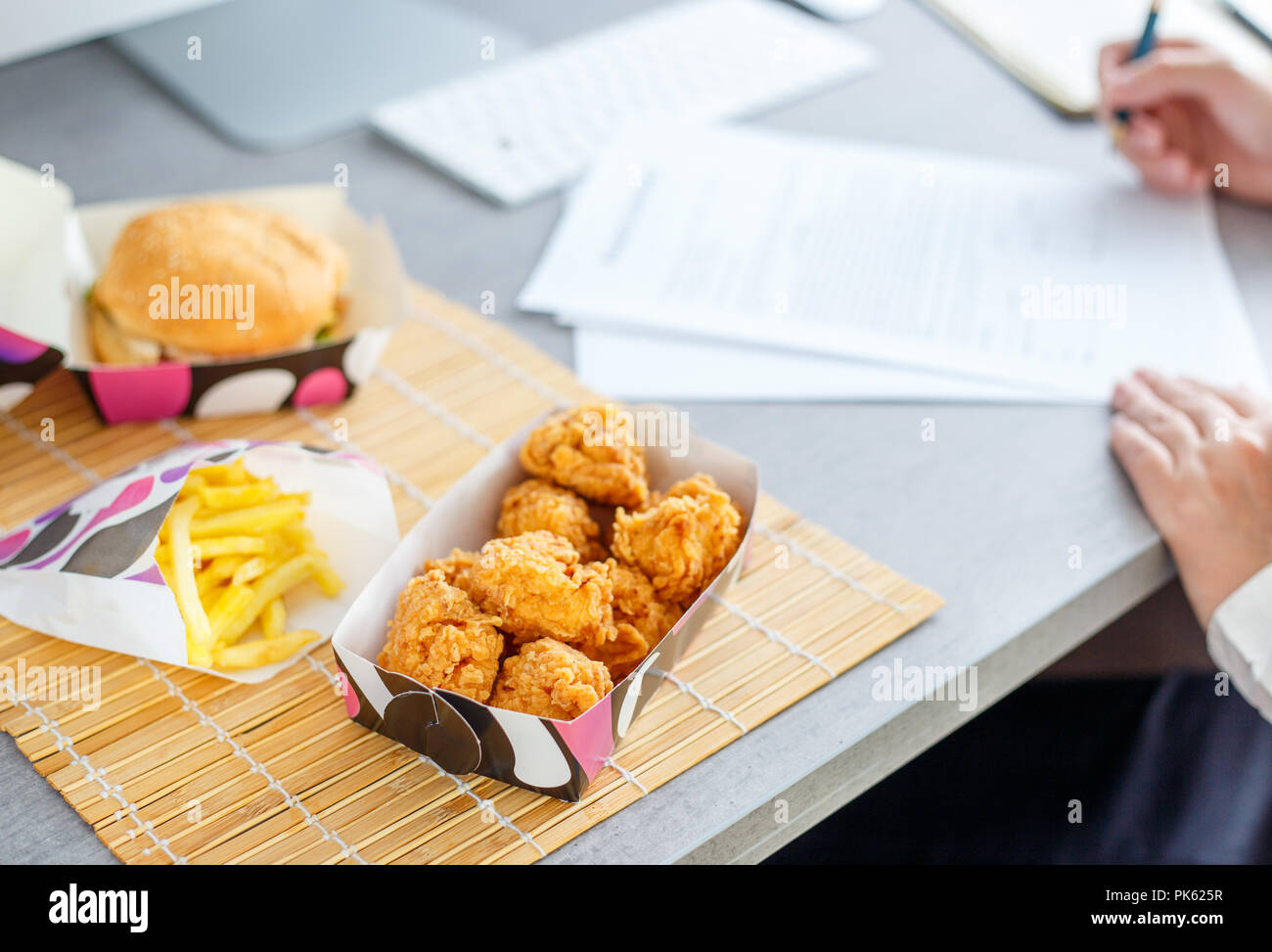 lunch time at the work place. Fast food delivery concept image Stock Photo