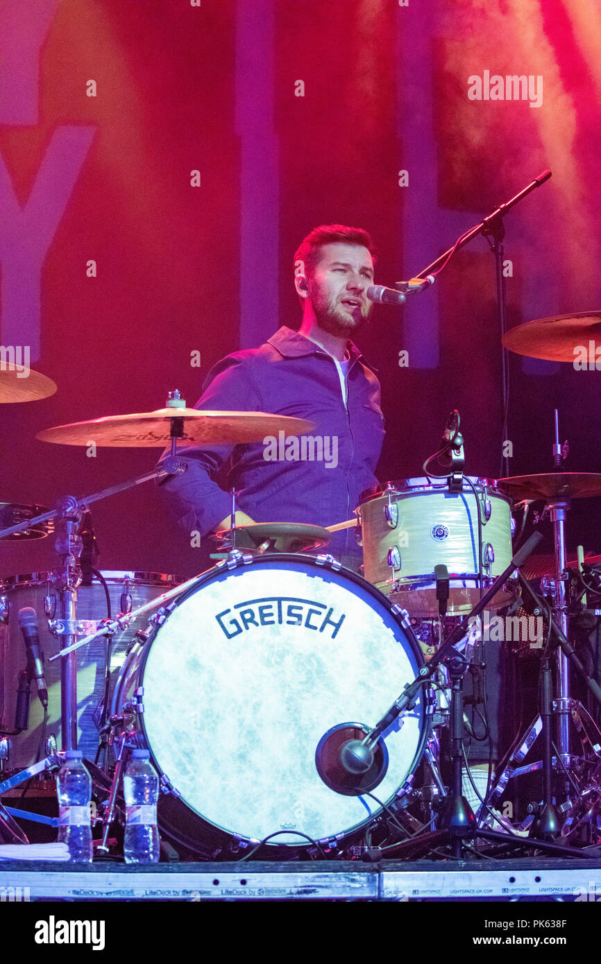 Drummer Michael Spearman of band Everything Everything at the finale of one of their songs live at Festival Number 6, Portmeirion, Wales Stock Photo