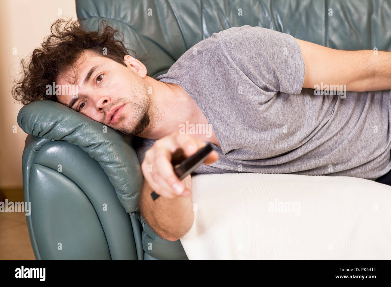 Lazy Man With The Remote On The Couch Stock Photo 218337760 Alamy