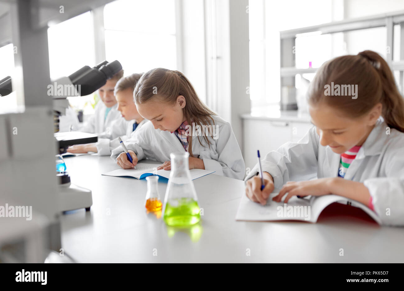 kids studying chemistry at school laboratory Stock Photo Alamy