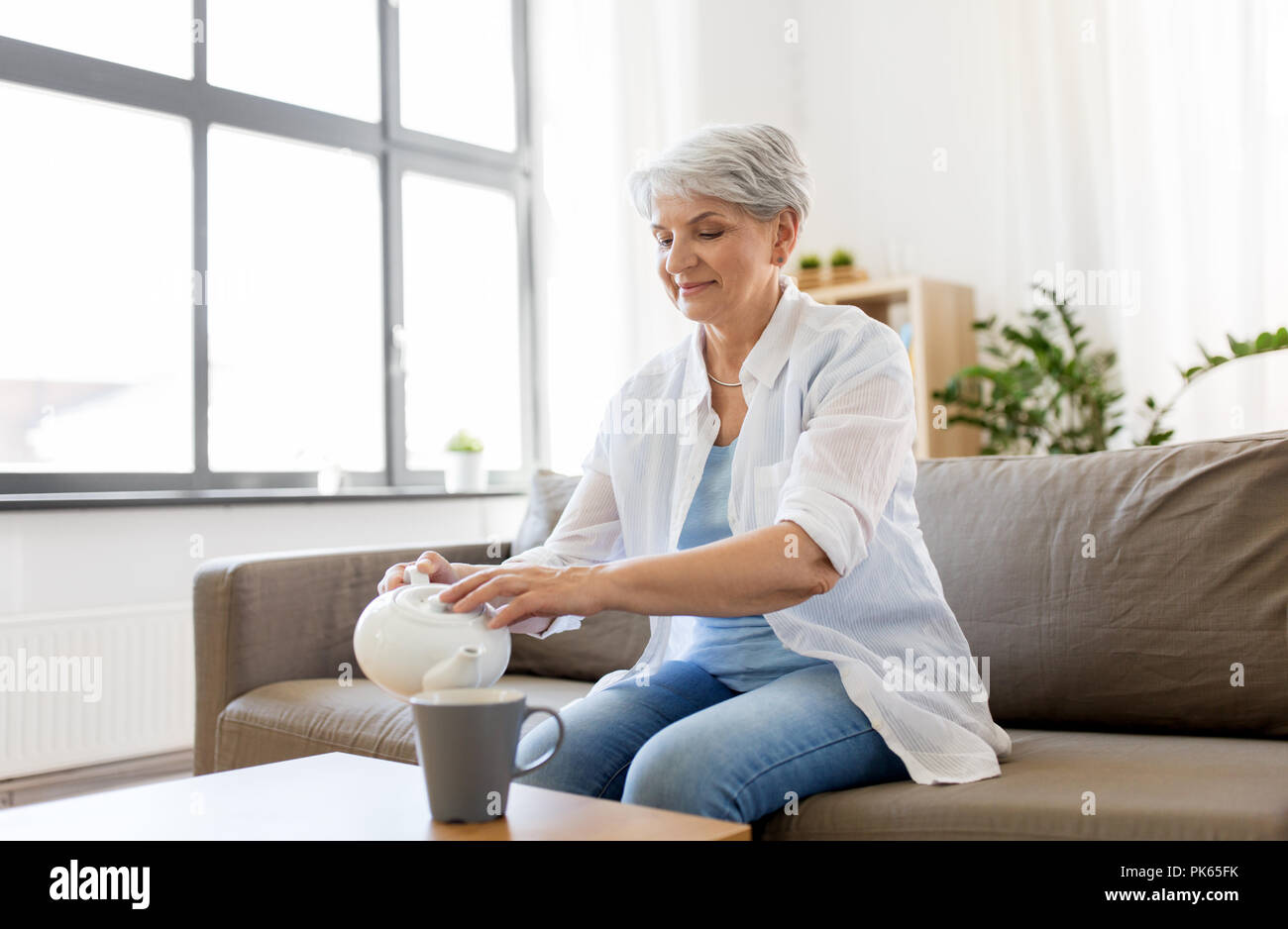 Old lady drinking tea hi-res stock photography and images - Alamy