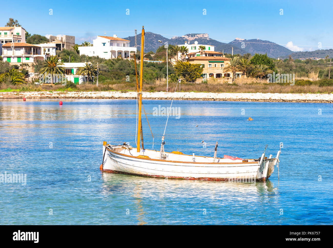 Romantic view of old fishing boat at coast of Portopetro on Mallorca island, Spain Mediterranean Sea Stock Photo