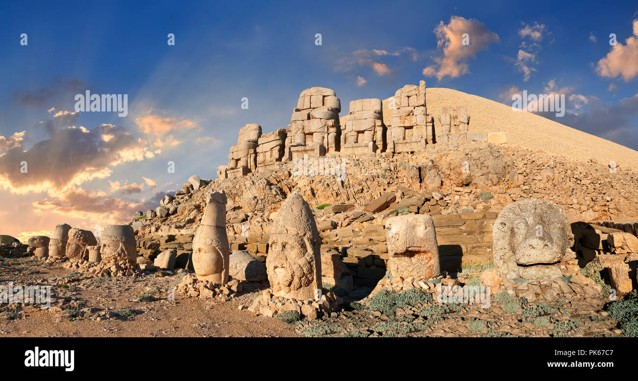 Statue heads at sunset, from right,  Lion, Eagle, Herekles, Apollo, Zeus, Commagene, Antiochus, & Eagle, west Terrace, Mount Nemrut or Nemrud Dagi Stock Photo