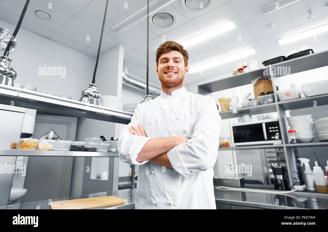 happy male chef cook at restaurant kitchen Stock Photo