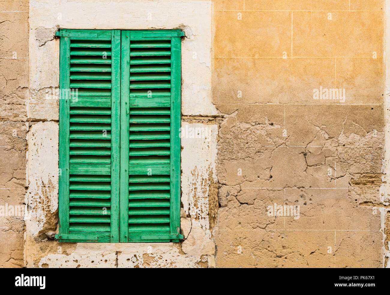Old green wooden window shutters and grunge wall background Stock Photo ...