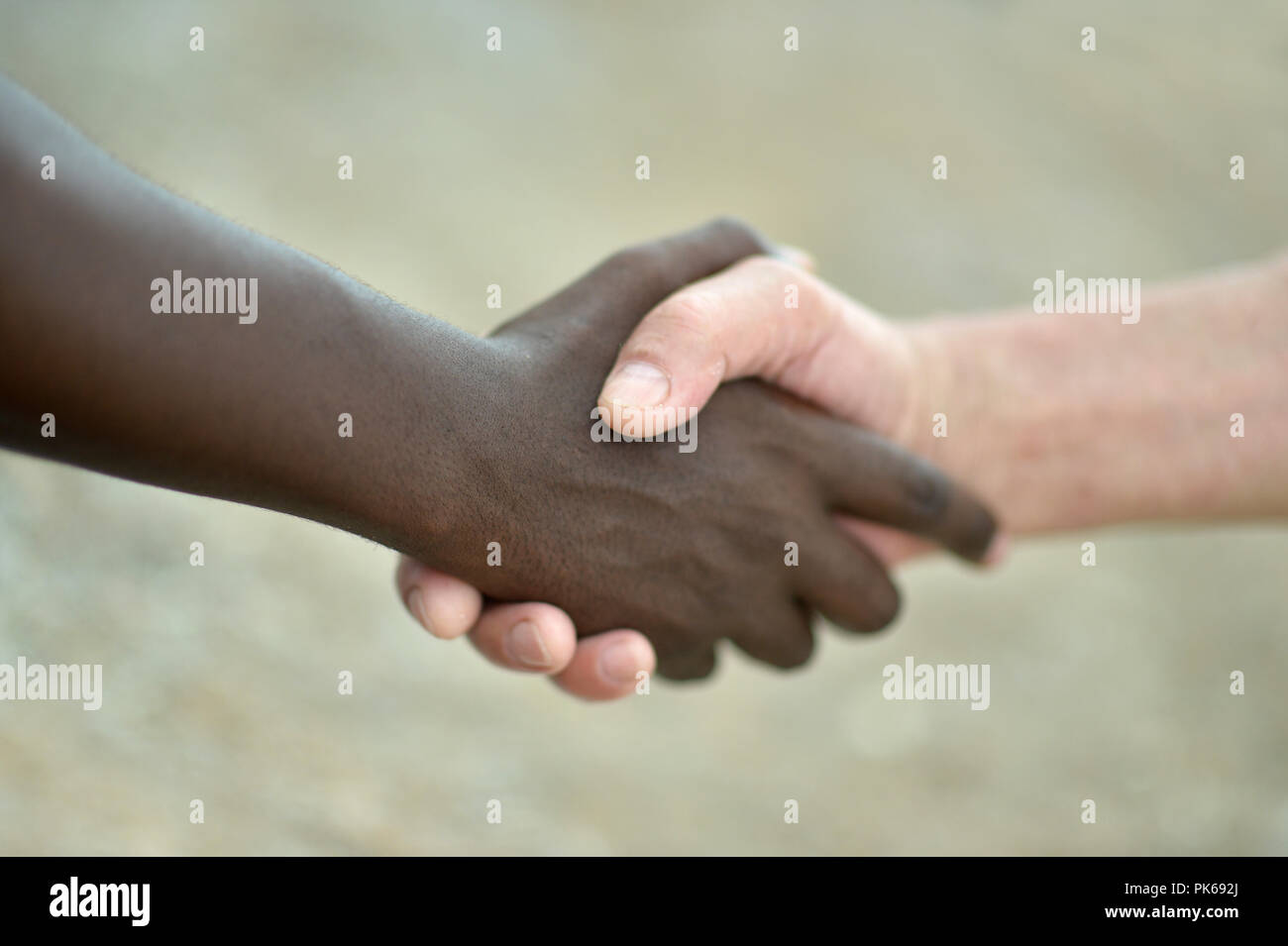 Multi-Ethnic Close up portrait of hands in handshake Stock Photo