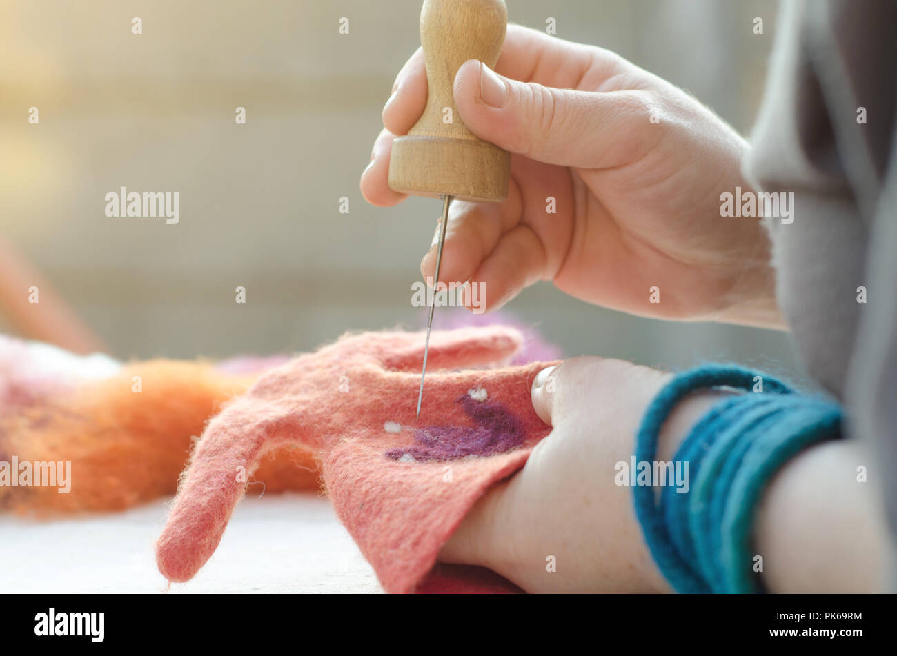 Process of felting. felted decoration made of wool with a traditional