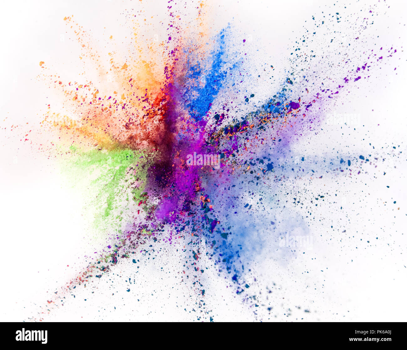Explosion of coloured powder isolated on white background. Abstract colored background Stock Photo