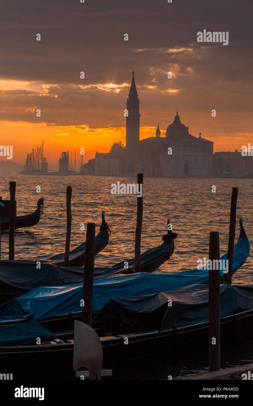 Morning in Venice. Gondolas at the pier Stock Photo - Alamy