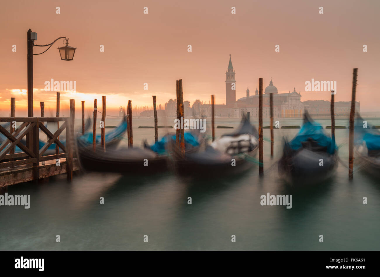 Morning in Venice. Gondolas at the pier Stock Photo - Alamy