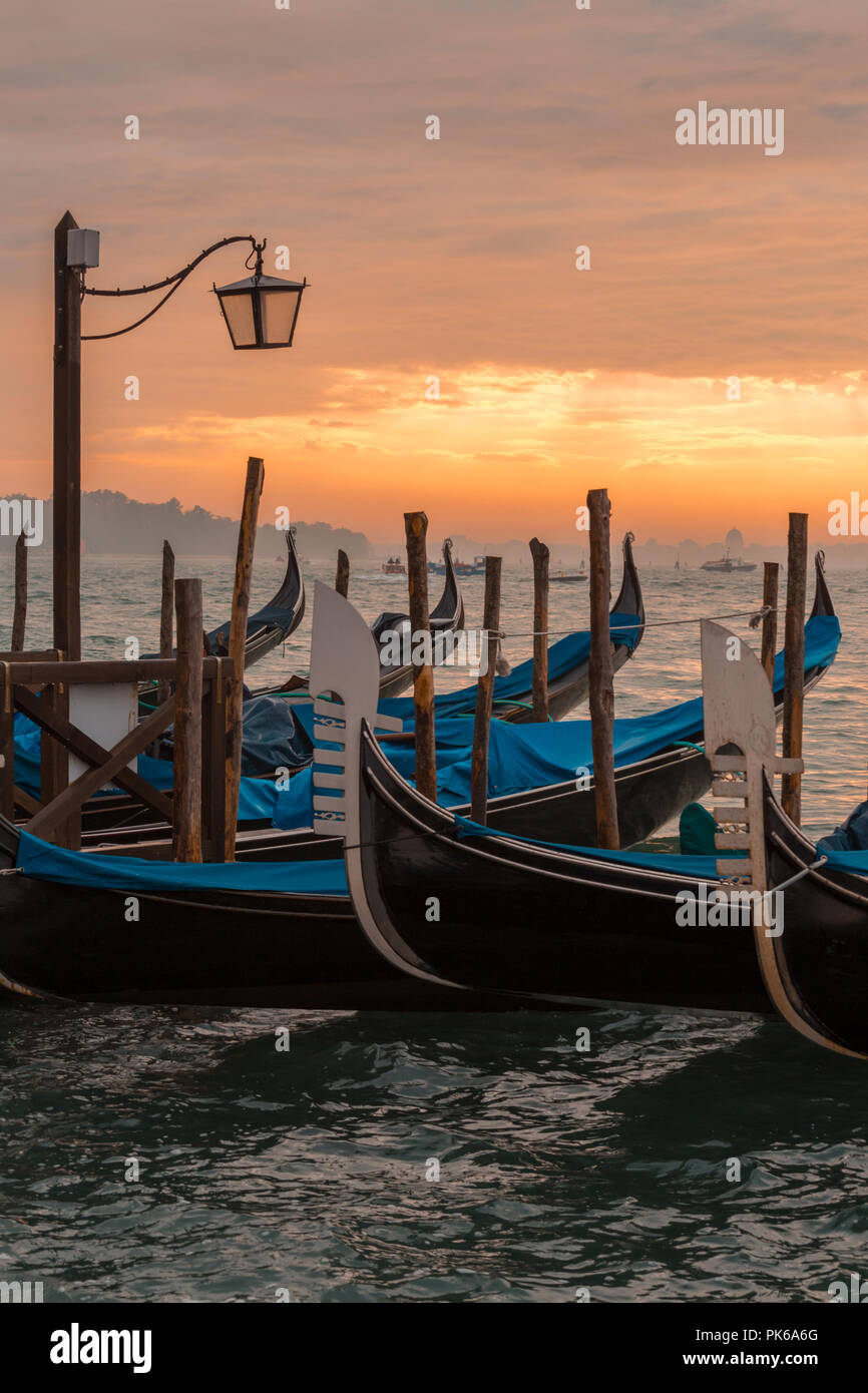 Morning in Venice. Gondolas at the pier Stock Photo - Alamy