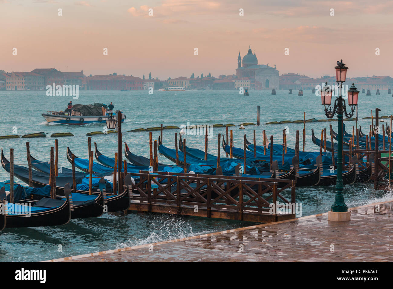 Morning in Venice. Gondolas at the pier Stock Photo - Alamy