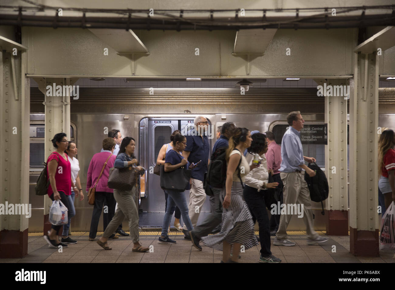 Shuttle train at Times Square along 42nd Street taking workers mostly to Grand Central Terminal at the evening rush hour. New York City. Stock Photo