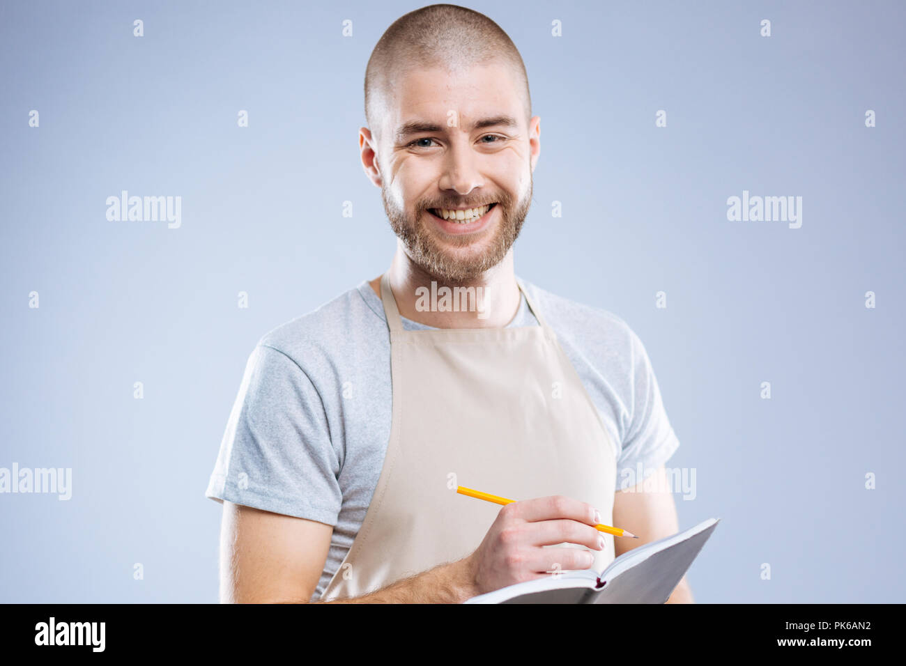 Cheerful nice man being ready to take notes Stock Photo