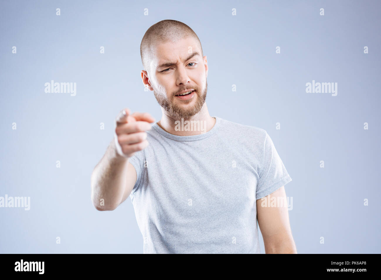 Joyful good looking man winking to you Stock Photo - Alamy