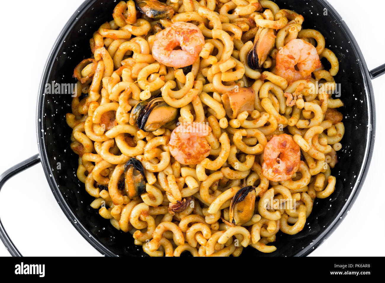 Traditional Spanish fideua. Noodle paella isolated on white background. Top  view Stock Photo - Alamy