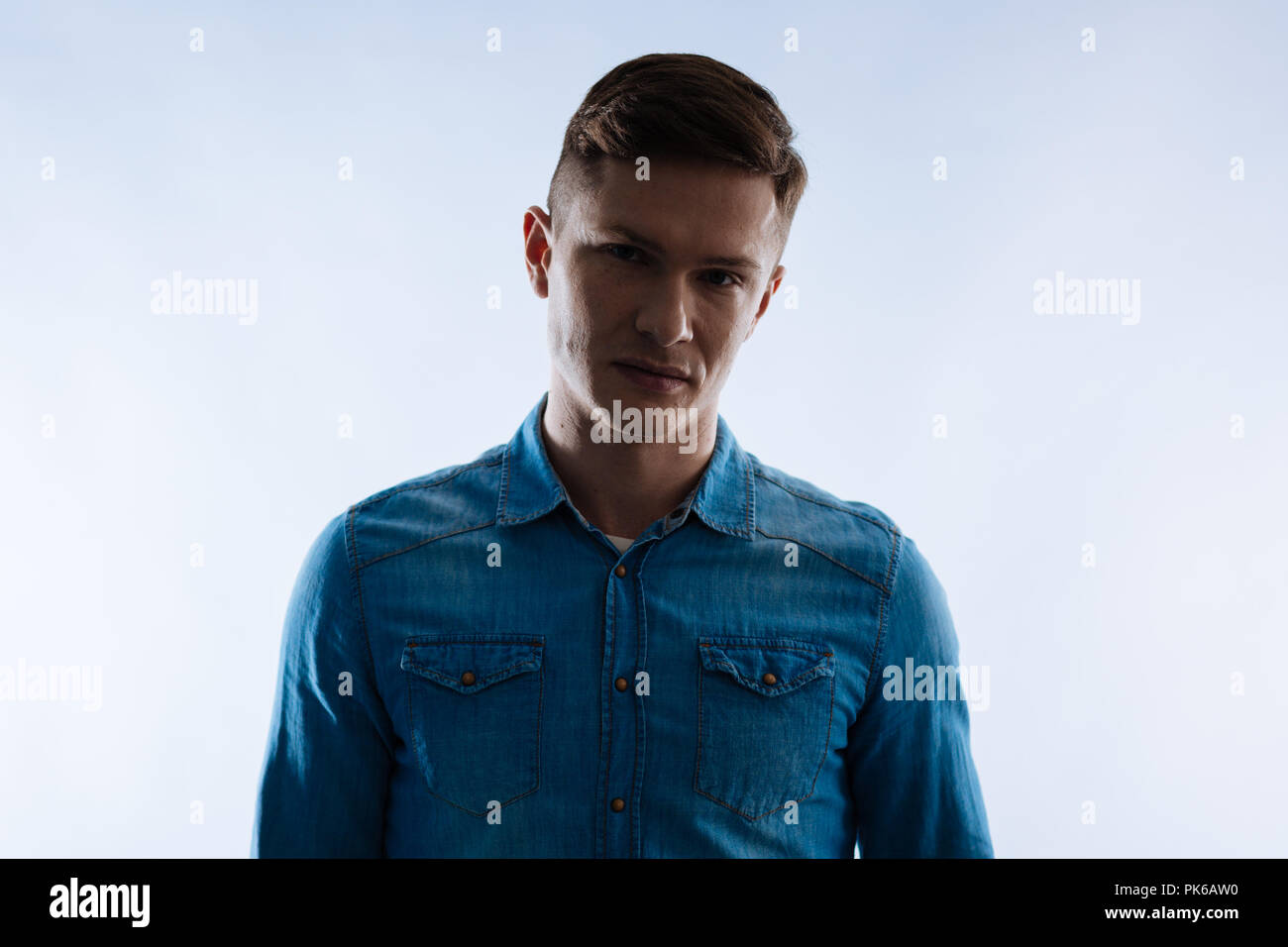 Serious nice man looking in front of him Stock Photo