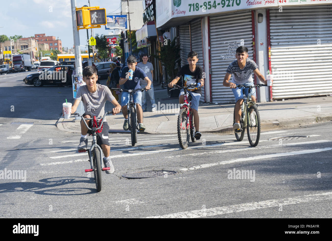 Boys riding bikes together during summer vacation in the Windsor