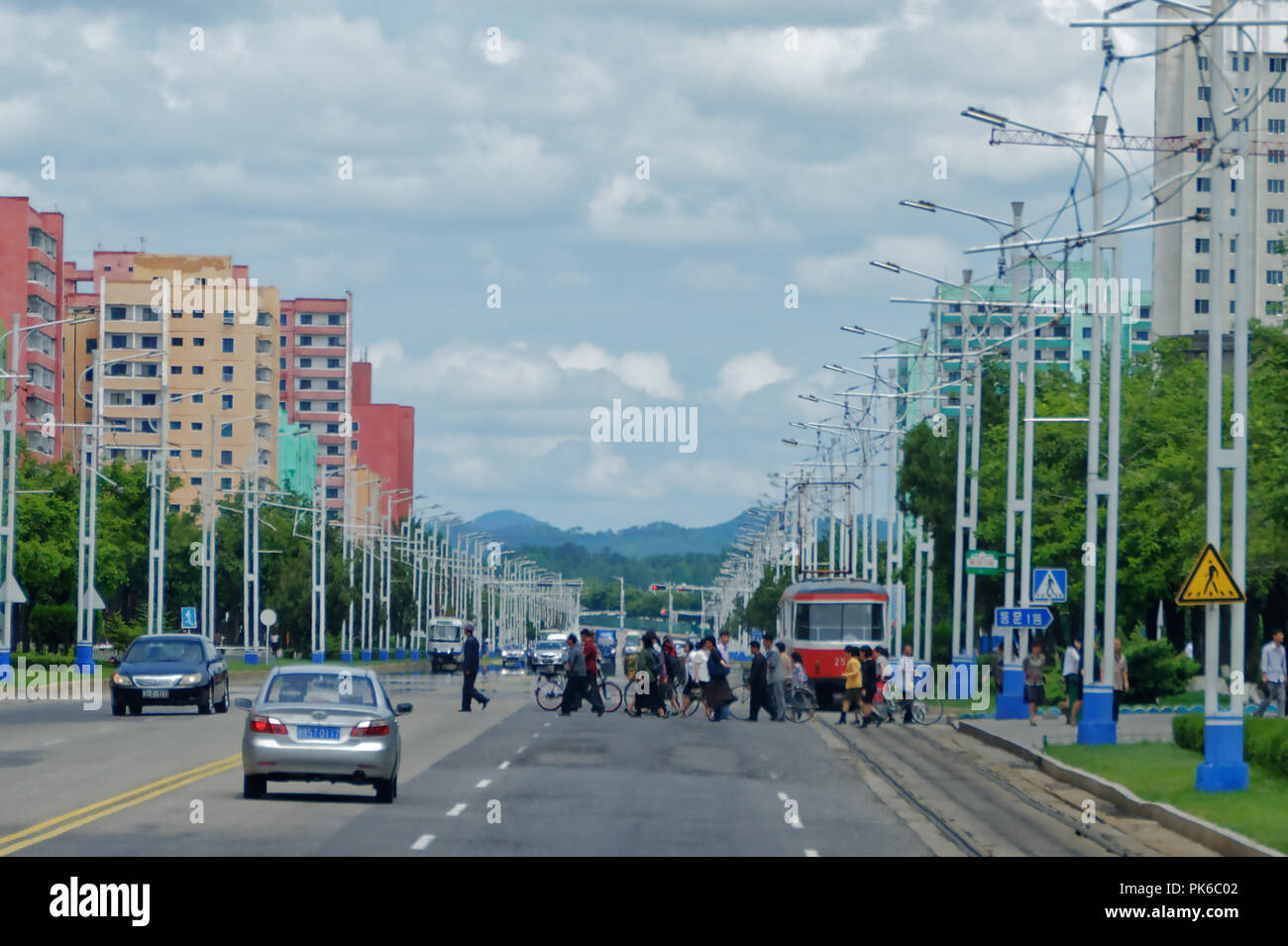 Safety in numbers as Pyongyang residents cross the road, North Korea Stock Photo