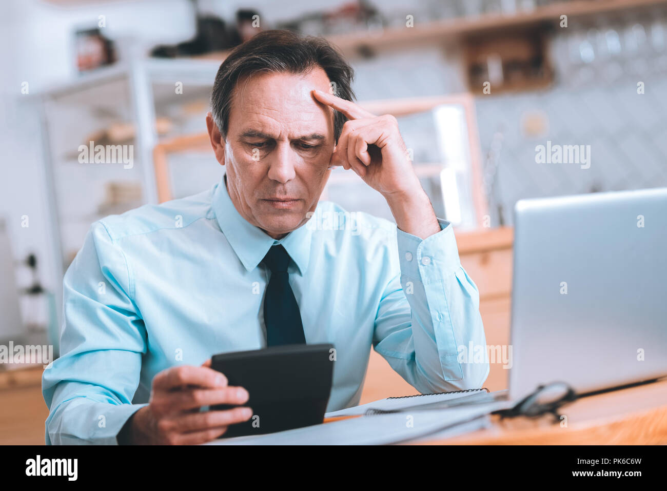 Serious businessman being deep in thoughts Stock Photo Alamy
