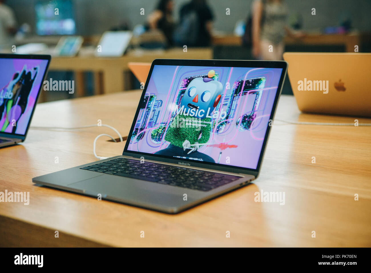 Berlin, August 29, 2018: Retail sale of new MacBooks in the official store of Apple in Berlin. Modern and stylish laptops. Stock Photo