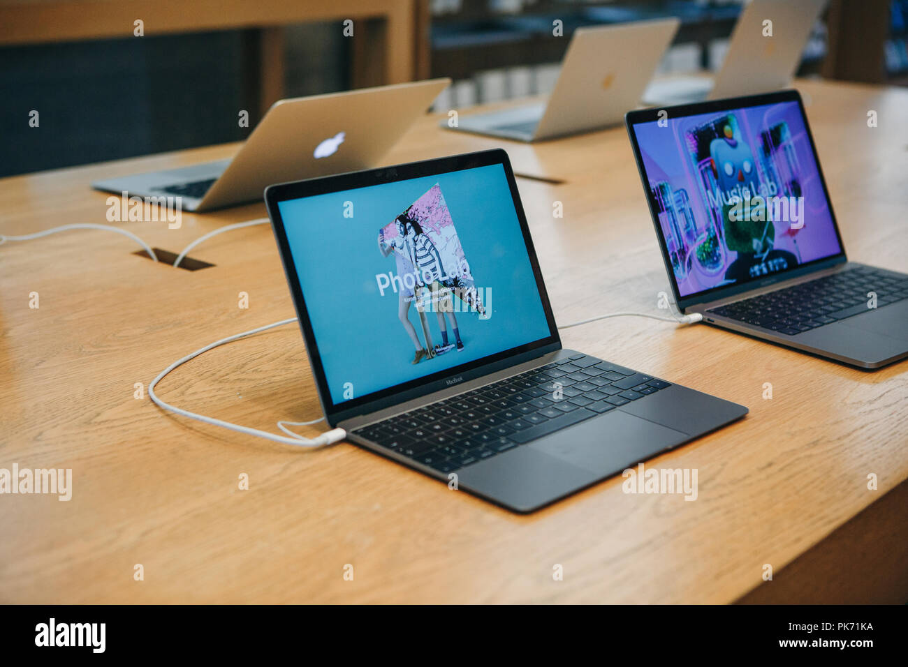 Berlin, August 29, 2018: Retail sale of new MacBooks in the official store of Apple in Berlin. Modern and stylish laptops. Stock Photo