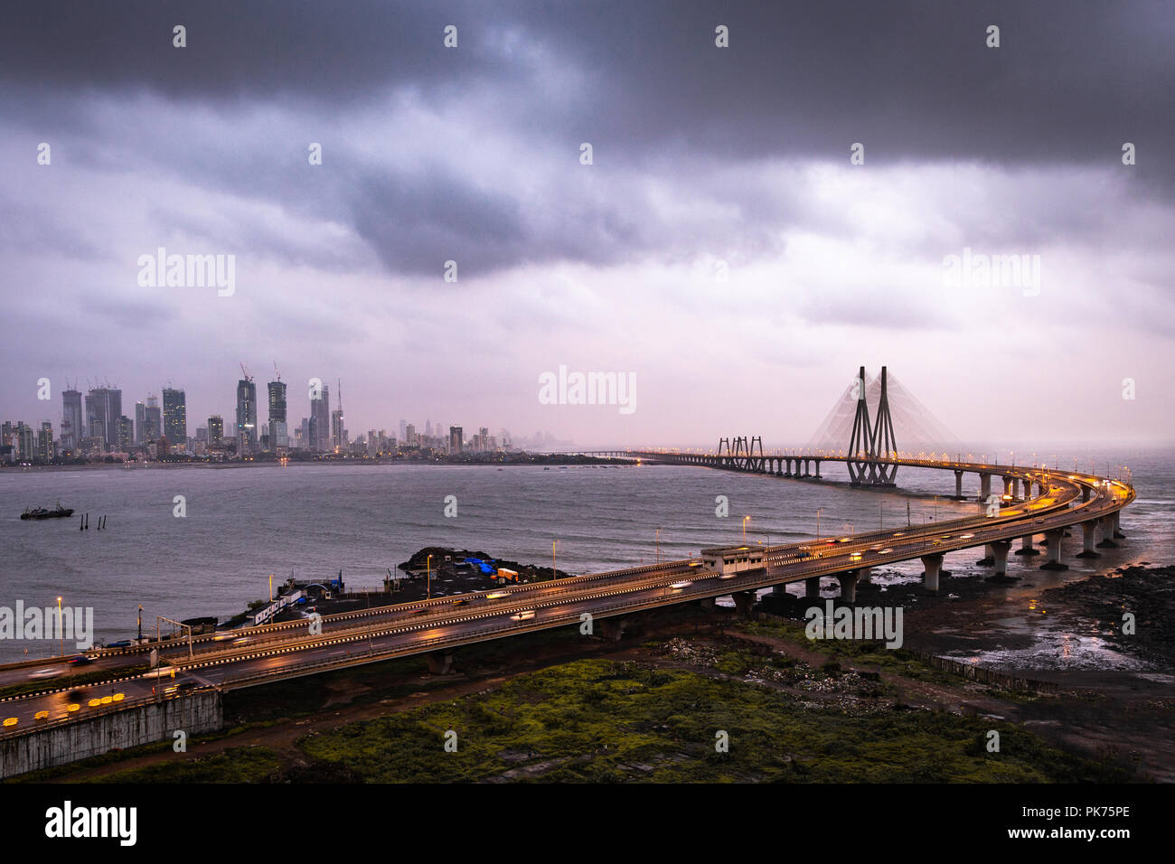 Birds eye view of Sea Link Mumbai right after sunset during monsoon under heavy clouds Stock Photo
