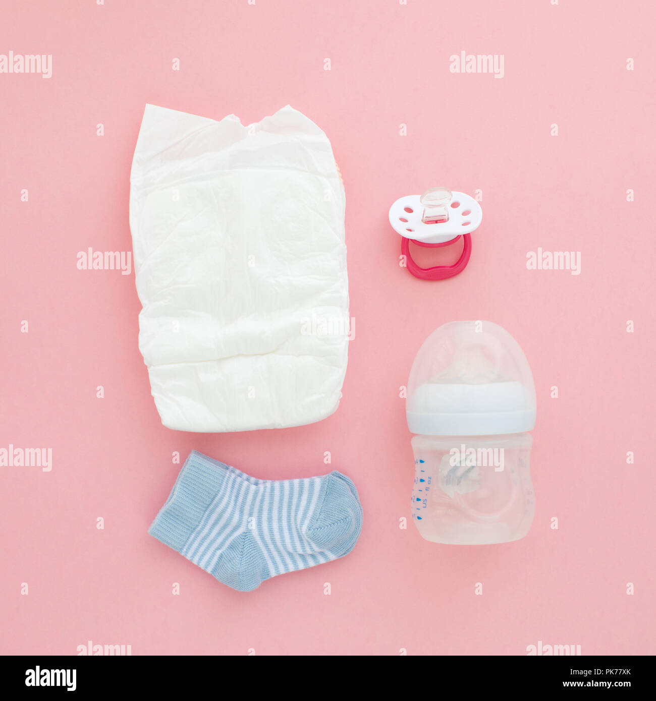 Set for a newborn nipple bottle diaper socks Stock Photo
